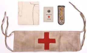 A WW1 German tie-on linen Red Cross armband, with indistinct official rubber stamps; a linen arm