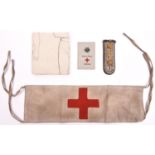 A WW1 German tie-on linen Red Cross armband, with indistinct official rubber stamps; a linen arm