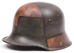 A German M16 steel helmet, with typical camouflage finish and original leather liner. GC (no