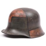 A German M16 steel helmet, with typical camouflage finish and original leather liner. GC (no