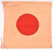 A Japanese double-sided flag or banner, with plain red disc centre and cord ties to two corners,