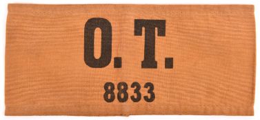 A Third Reich armband, black “O T 8833” on khaki (Organisation Todt), GC