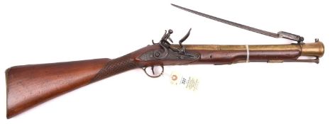 A brass barrelled flintlock blunderbuss with spring bayonet by Wallis (of Hull”), c 1785, 29½”