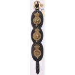 A leather strap mounted with 3 martingale brass badges, Vic infantry mounted officer's, post 1902