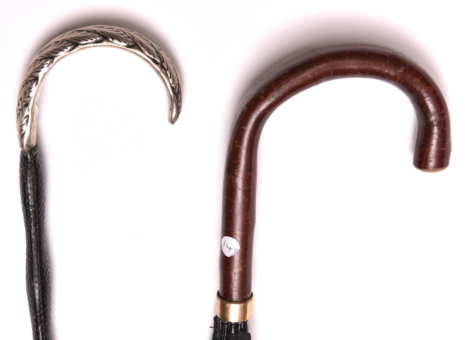 2 Umbrellas: plain bent hazel handle with plain 9ct. gold band; and long leather-covered haft with - Image 2 of 2
