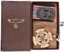 A Third Reich 1st class Luftschutz Decoration, with ribbon, in its box. GC (gilt finish worn);