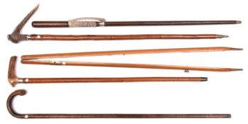 5 walking sticks malacca with staghorn handle and white metal band; knobbly wood with staghorn