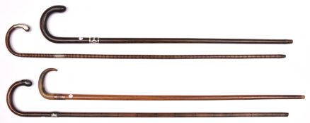 4 walking sticks: pale wood with horn crook handle and copper band embossed with figure of Nelson,