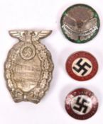 A Third Reich 1931 SA Brunswick Rally pressed tin pin “ back badge; an NSKK Kriegskraftfahrerin