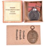 Third Reich Eastern Front medal, in card box with printed label, and West Wall medal with printed