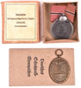 Third Reich Eastern Front medal, in card box with printed label, and West Wall medal with printed