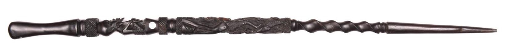 An African carved ebony walking cane. Carved with three-dimensional bearded, seated figure, other