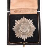 A Third Reich “Ostvolker” medal, 1st class in silver (grey metal) with swords, in its fitted case.