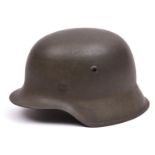 A German M42 single decal Waffen-SS steel helmet, with maker's code and serial number to rear edge(