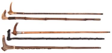 5 walking sticks: malacca with staghorn handle having silver tip and band (HM B'ham 1896); bamboo