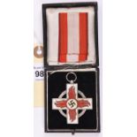 A Third Reich Fire Service Cross, 2nd class, GC (slight wear to plating), in its case with short