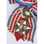 Liberia: Order of African Redemption sash and sash badge, in gilt with 5 pointed white enamelled