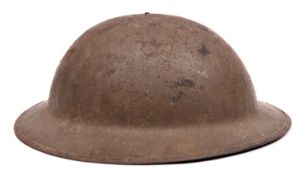 A WWI Brodie's pattern steel helmet, oilcloth, netting, leather and fabric lining, fragment of