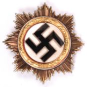 A Third Reich Deutschers Kreuz in gold, with 4 visible hollow rivets and 2 unusual bar fittings (