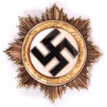 A Third Reich Deutschers Kreuz in gold, with 4 visible hollow rivets and 2 unusual bar fittings (