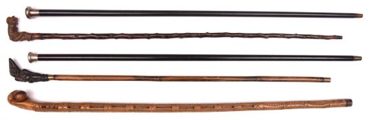 3 walking sticks: folk art carved boxwood, hollow pierced containing balls and cylinders, with