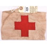 A Red Cross buff linen armband, with superimposed cross, the back bearing indistinct Air Ministry