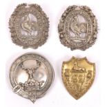 A cast WM glengarry badge of the Donside Highland Vol Bn. Gordon Highlanders, and another similar