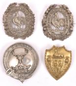 A cast WM glengarry badge of the Donside Highland Vol Bn. Gordon Highlanders, and another similar