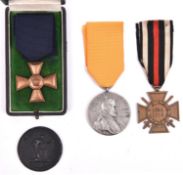 A 1916 “Iron for Gold” medallion; a Prussian 15 year Long Service medal, in a case; 1914-18 Honour