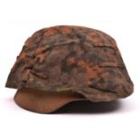 A German M40 ? type steel helmet, lacking maker's mark and serial number, with leather liner and