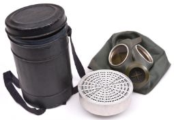 A Third Reich civilian gas mask, the thin rubber and aluminium filter with clear waffenamt marks.