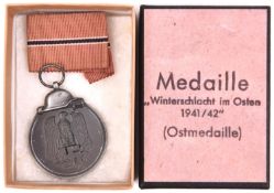 A Third Reich Eastern Front medal, in card box with printed label, the bottom marked “LDO” in