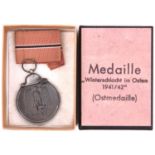 A Third Reich Eastern Front medal, in card box with printed label, the bottom marked “LDO” in