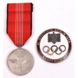 A Third Reich 1936 Olympic Games medal, with ribbon; and an enamelled pin-back Olympics judges