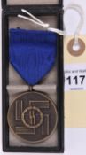 A Third Reich SS bronze 8-year Service medal, with ribbon and pin, in its case with SS runes on