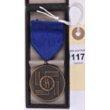 A Third Reich SS bronze 8-year Service medal, with ribbon and pin, in its case with SS runes on