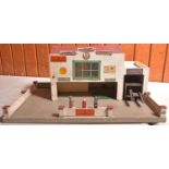 2x Tri-ang Minic items. A Minic Service Station on two floors with ramp and lift. Wood and plywood