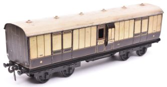 A Carette Gauge 2 L.N.W.R. Passenger Full Brake. A bogie coach in lined brown and cream livery.