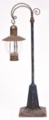 A Gauge One railway lamp by Bing. A cast lamp stand with tinplate base and brass lamp holder with