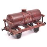 A Gauge One Millbro Oil Tank Wagon. Maroon painted wooden body and chassis and 'Tare 6-4-0' and '