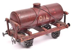 A Gauge One Millbro Oil Tank Wagon. Maroon painted wooden body and chassis and 'Tare 6-4-0' and '