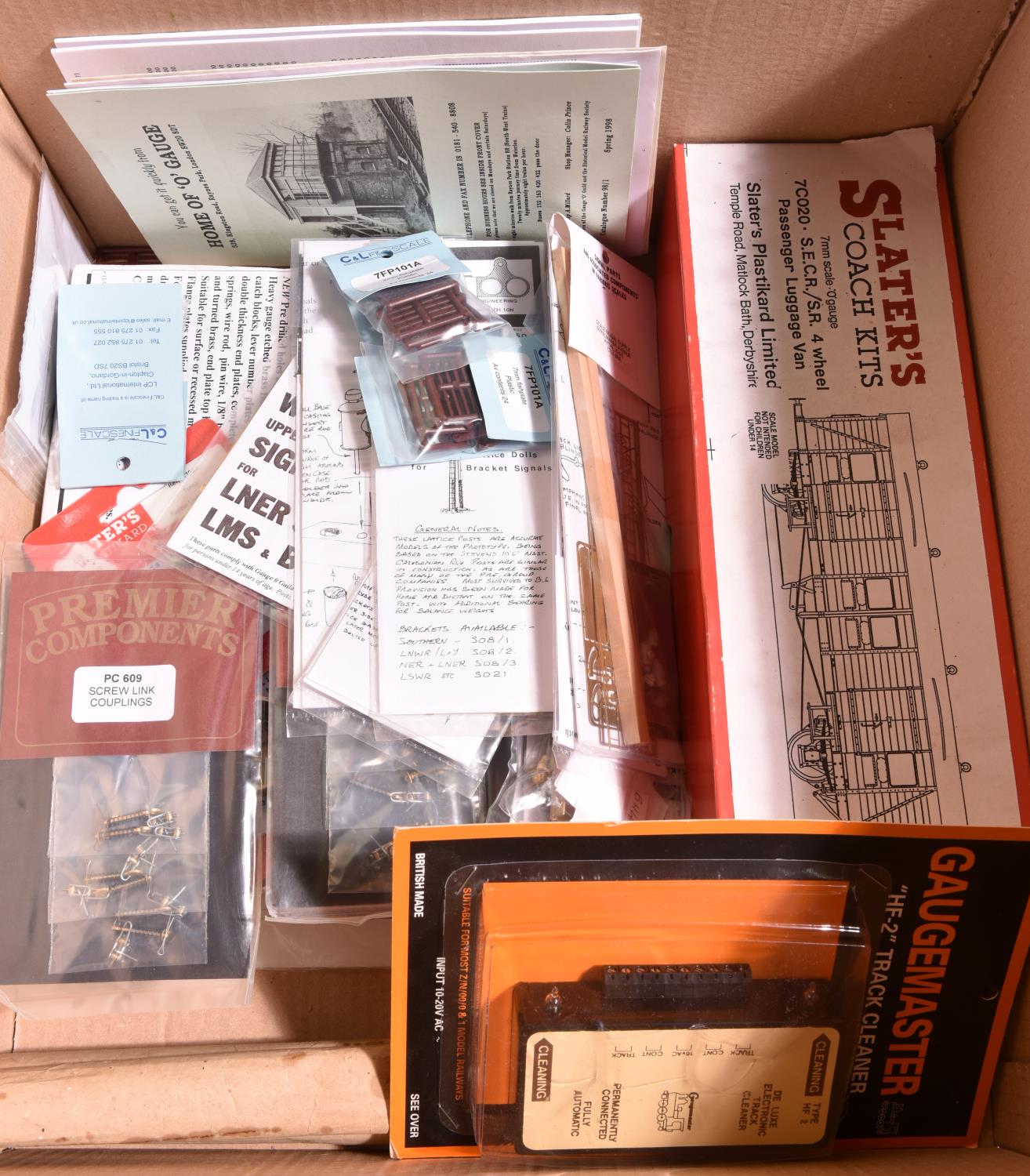 A quantity of O Gauge 7mm finescale railway unconstructed kits and unopened accessories.