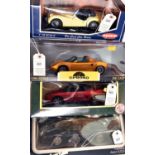 4 1:18 scale Cars. Chrono 1997 Lotus Elise in Norfolk Mustard. Kyosho Triumph TR3A in Yellow.