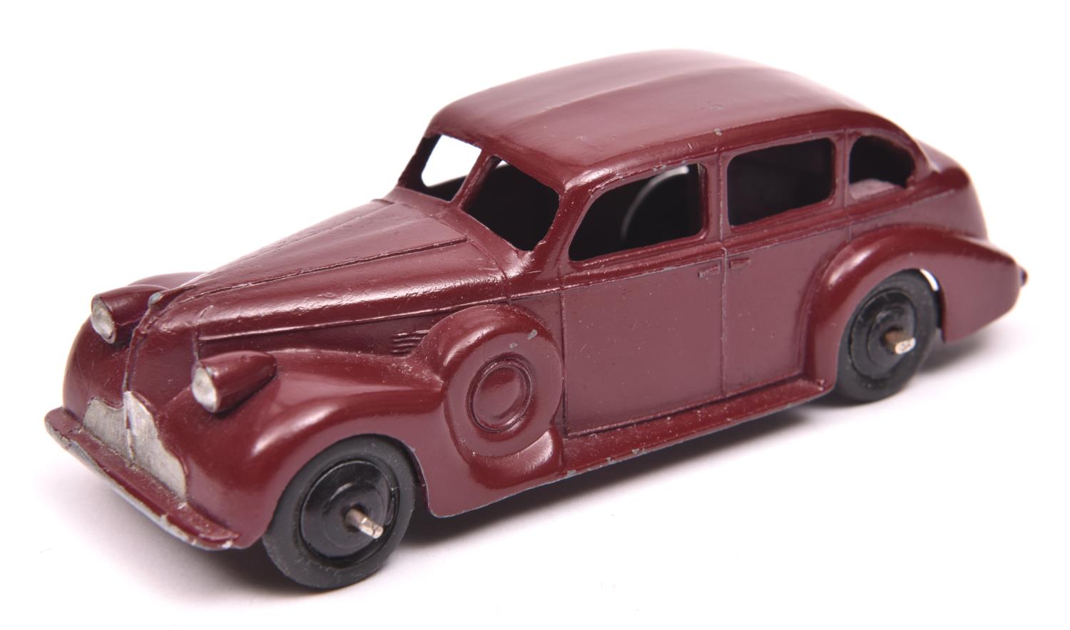 Dinky Toys 39 Series Buick Viceroy (39d). An example in maroon with black painted base, black ridged