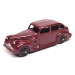 Dinky Toys 39 Series Buick Viceroy (39d). An example in maroon with black painted base, black ridged