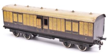A Carette Gauge 2 L.N.W.R. Passenger Full Brake. A bogie coach in lined brown and cream livery.