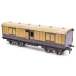 A Carette Gauge 2 L.N.W.R. Passenger Full Brake. A bogie coach in lined brown and cream livery.