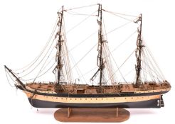 A wooden kit built model of a 3-mast Tea Clipper in the style of the Cutty Sark. A well