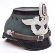 A Third Reich fibre Police shako, with aluminium badge and cockade, leather chinstrap, and maker’s
