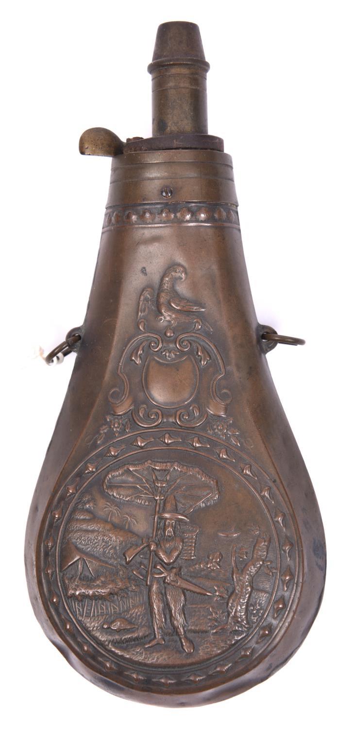 A very rare unmarked French copper powder flask, 6¾”, the embossed design inspired by “Robinson